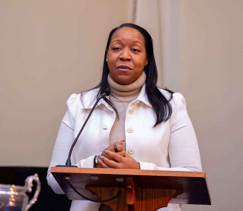 Courtney Johnson speaking at a leadership event